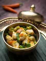 Crab meat and yellow chillies stir- fry on wood table,Thai food