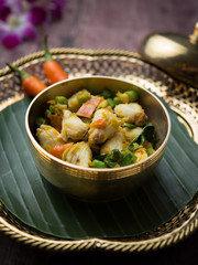 Crab meat and yellow chillies stir- fry on wood table,Thai food