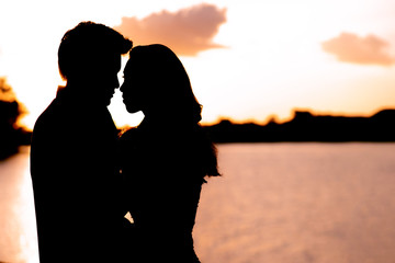 The silhouette of women and men in love