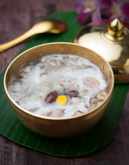 Soybean juice and millet seeds with coconut milk on wood,Thai dessert