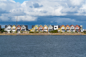A row of colorful houses at the water's edge