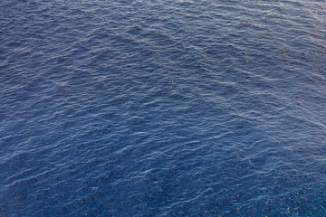 Dark blue ocean surface covered with waves