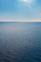 Blue wave surface of the sea going to the horizon