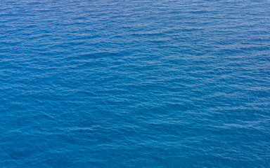 Blue sea surface covered with waves