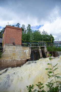 Finnish river running wild in the nature. Close photos of powerful water streams.