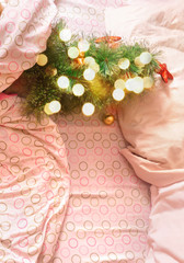 Christmas tree lying in bed in the morning