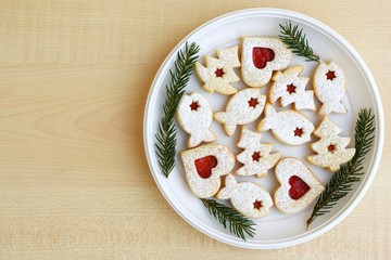 Linzer cookies filled with red jam and dusted with powdered sugar
