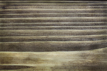 Background of an old burnt board. Vintage texture of a wooden surface. Retro dark brown old rustics grunge wood texture. Trendy stylish backdrop  for decoration, cover and design