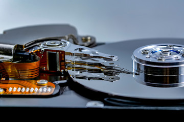 Disassembled hard drive from the computer, hdd with mirror effect. Opened hard drive from the...