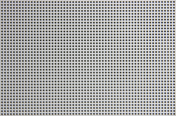 Background of gray aluminum plate with round holes