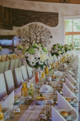 Beautifully decorated wedding table and other details at wedding hall. Wedding day.