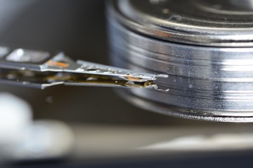 Disassembled hard drive from the computer, hdd with mirror effect. Opened hard drive from the computer hdd disk drive with mirror effects. Part of computer pc, laptop.