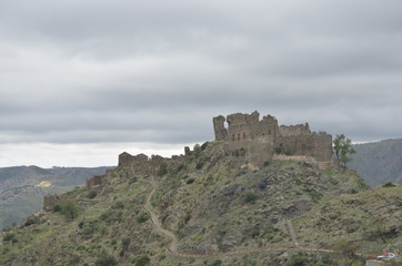 Fototapeta na wymiar old abandoned castle trekking in the edge of Amendolea Bova national park Aspromonte