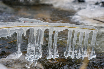 Naklejka na ściany i meble icicles above the river