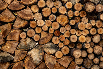 neatly stacked chopped firewood, background image texture