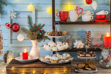Christmas bar cacao decoration with cookies and sweets on blue w