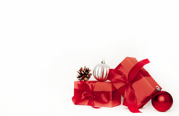 New Year or New Year composition on a white background with gift boxes, with a red ribbon, toys, copy space for congratulations