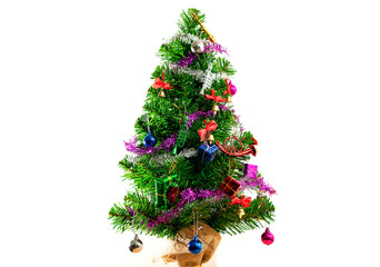 Green Christmas tree decorated with gifts And white background