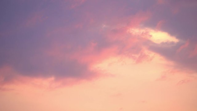 TimeLapse. 4K. Dramatic sunset. Fast moving purple, pink, red, orange, blue clouds in the sky. Natural colors. Evening sky. Time Lapse Ultra HD stock footage