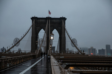 Brooklyn bridge under the rain and mist