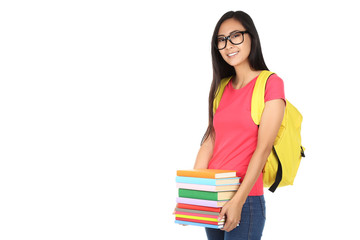 Young woman with books and backpack on white background