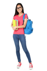 Young woman with books and backpack on white background