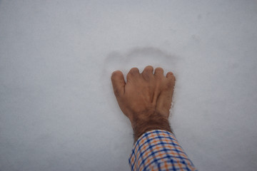 Disabled hand  on the snow.