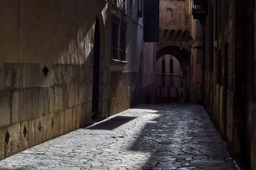 Lonely medieval street in the city of Palma. Gothic Quarter Stone floor.