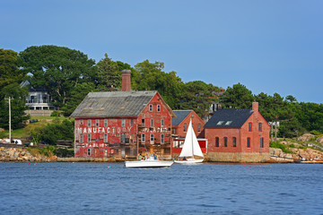 Fototapeta na wymiar Tarr and Wonson Paint Manufactory is one of the most famous landmarks on the North Shore Massachusetts in Gloucester Harbor, Massachusetts MA, USA.