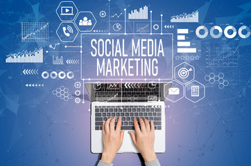 Social media marketing concept with person using a laptop computer