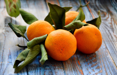 Mandarine orange, tangerines on wooden board.