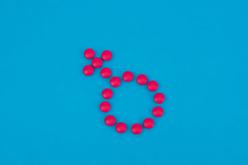 Venus mirror gender symbol made of pills or tablets. Medicine concept for woman. Women's health menopause, PMS, menstruation or estrogen.