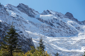 Fototapeta na wymiar Dombay mountains, trekking in national park to the Alibek waterfall and glacier, autumn landscape