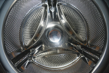 Washing machine drum close up background.