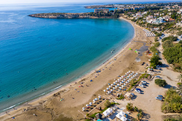Aerial top view of famous Coral Bay Beach near paphos, Cyprus. Idyllic tropical landscape for rest with sandy beach and clear azure water.