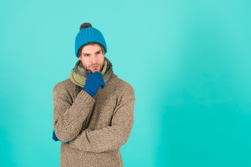 Seriously handsome and awesome. Handsome man with serious look. Thoughtful young man. Bearded man in winter style. Fashion and style. Winter trends. Caucasian man blue background, copy space