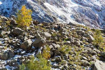 Beautiful turquoise lake in Dombay mountains, trekking in national park to the Alibek waterfall and glacier