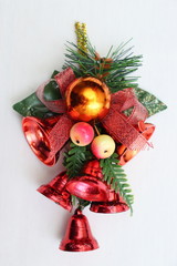 Merry christmas and a happy new year! Bright holiday decorations close-up. Plastic bells and pine twigs.