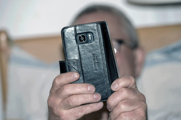 closeup of hand holding a mobile phone, sweden, stockholm, europe, nacka