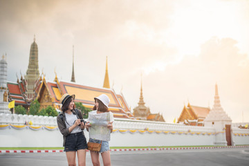 Naklejka premium Young Asian travel girls are enjoying with beautiful place in Bangkok, Thailand