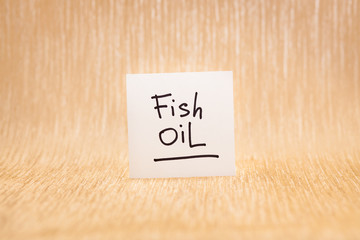 Fish oil - lettering on golden background, healthy lifestyle and omega 3 nutritional supplement