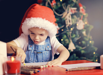 Christmas boy writing letter to Santa Claus