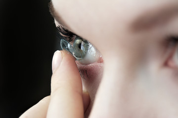 girl wearing soft contact lenses close-up macro