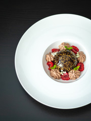 Mini mousse pastry dessert with chocolate glazed. Modern european cake. French cuisine.