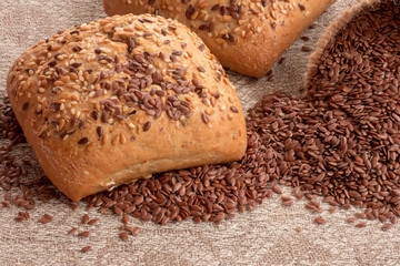 Flax seeds in linen and Bread with flax seeds  and sesame on the  table