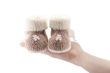 knitted baby booties for newborn isolated on white background