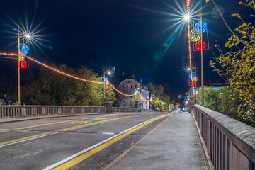 Bolzano, Italy 01 December 2019: Christmas decorations on the night streets of Bolzano.