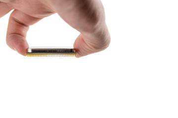 computer CPU in hand close-up isolated on white background