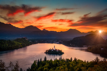 Fototapeta na wymiar Colorful landscape sunrise at Lake Bled with dramatic sky, Slovenia