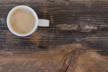 Coffee cup top view on dark wood table with copy space